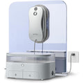 Robot lave vitres avec station alliant le deplacement sur la vitre et le nettoyage des surfaces vitrees